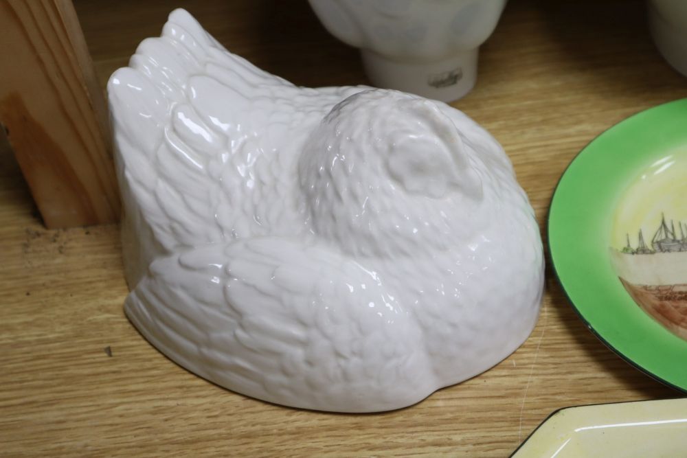 A small collection of Royal Doulton Dutch Harlem seriesware and five white-glazed jelly moulds,